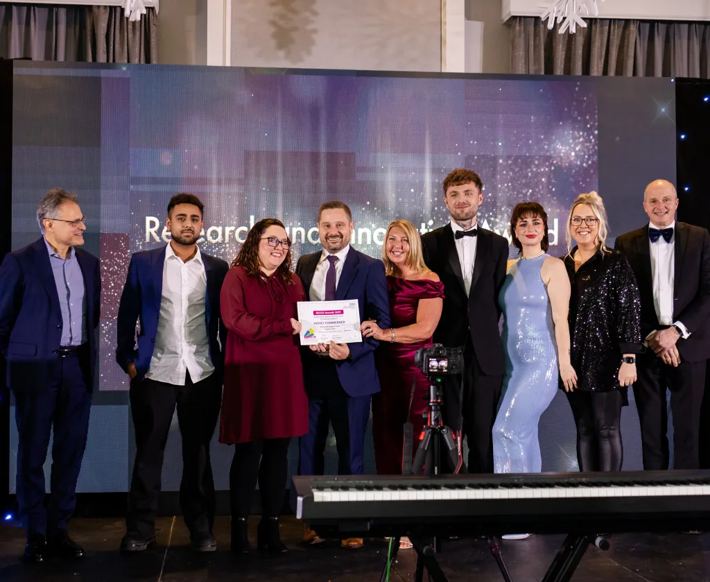 The team accepts their award