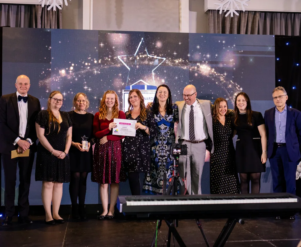 The team accepts their award