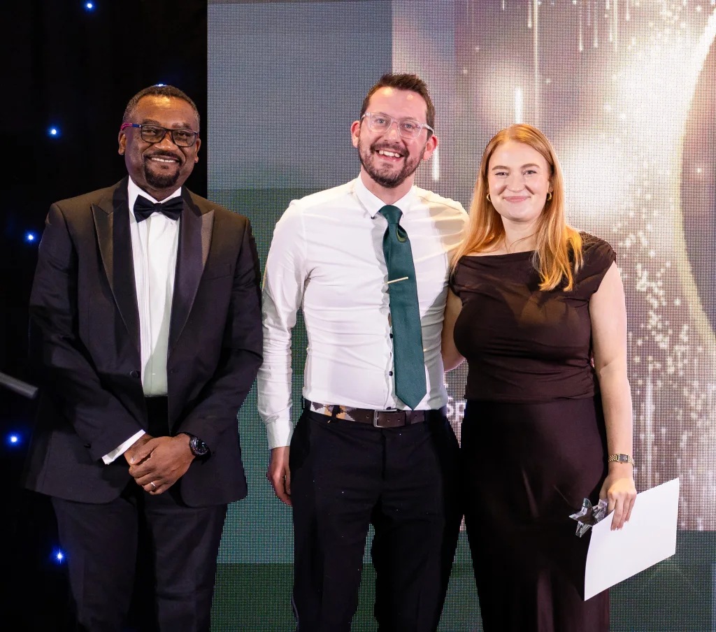 Charis accepts her award