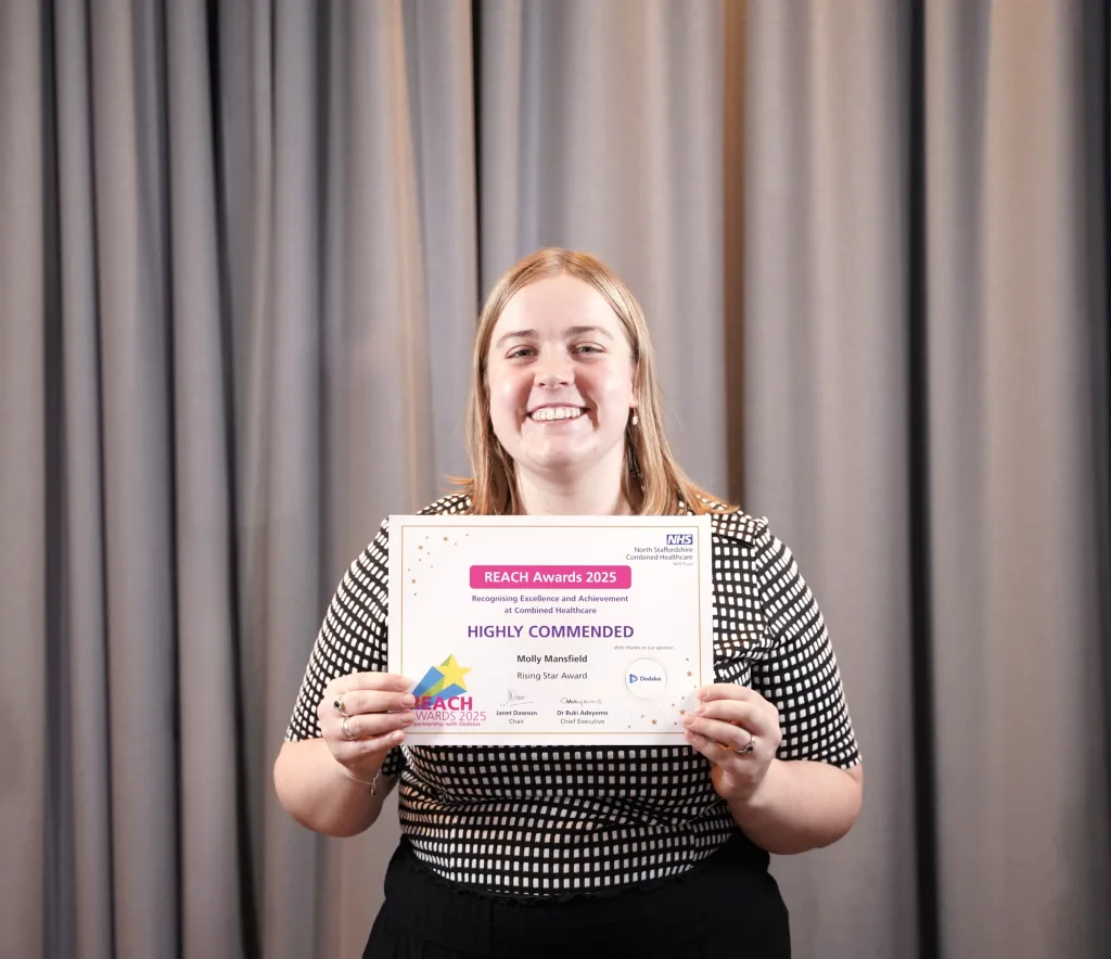 Molly poses with her award