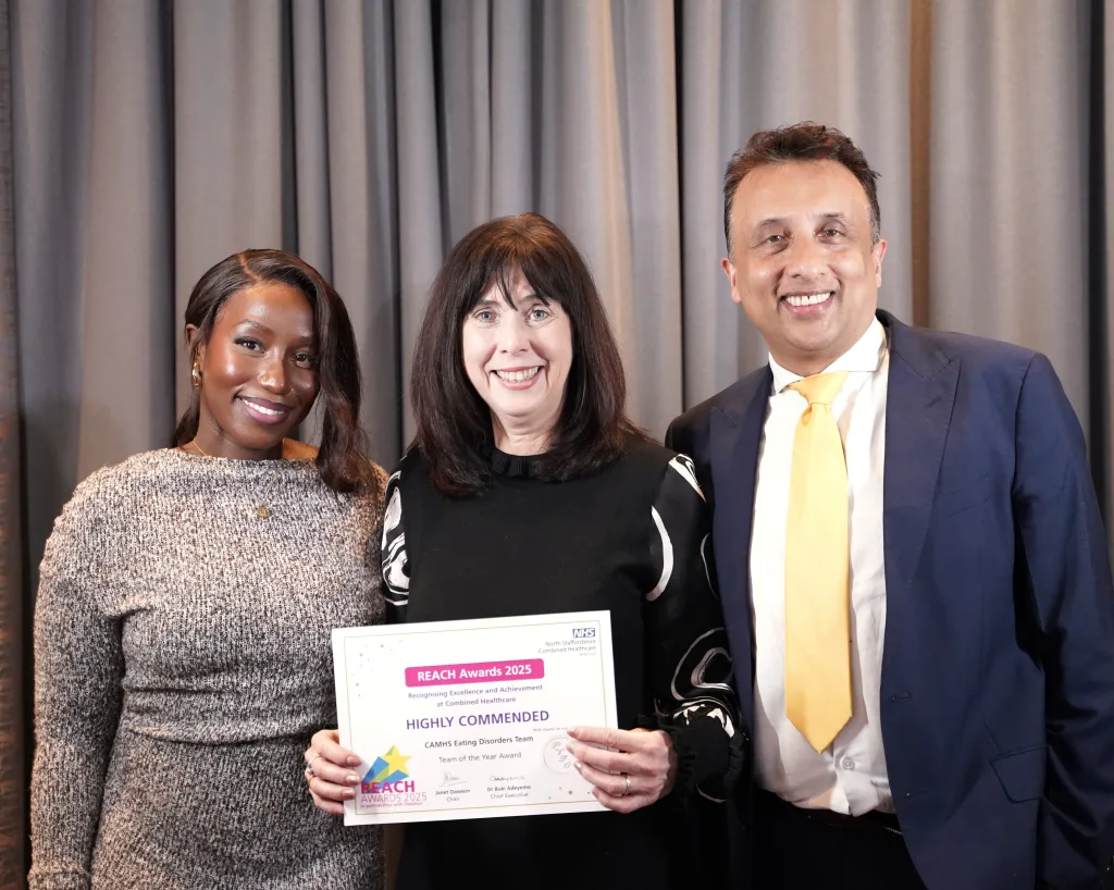 The team pose with their award