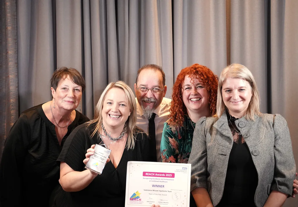 The team pose with their award