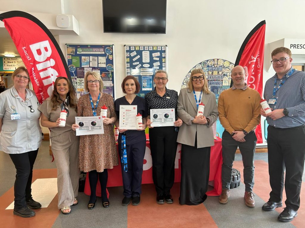 Staff pose for global recycling day