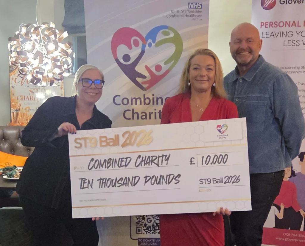 Representatives from Combined Charity and ST9 Ball pose with a donation cheque